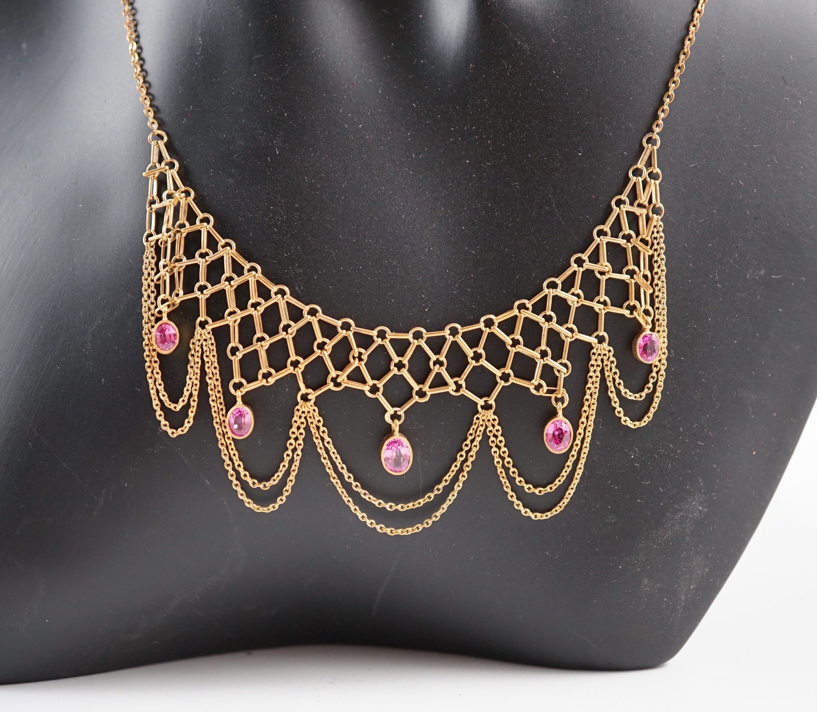 A 20th century 14k gold and five stone oval cut pink topaz set drop fringe necklace